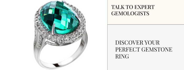 Silver ring with a green gemstone on a white background with text about gemstone rings.